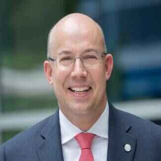 Brett J. Denton, EVP